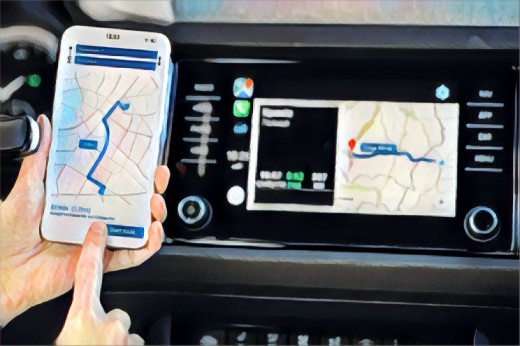 Ein Fahrer nutzt Smartphone und Auto-Navi zur Navigation.